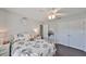 Bedroom featuring neutral walls, ceiling fan, and closet with doors at 7325 S Trask St, Tampa, FL 33616
