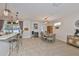 Open-concept dining area with tile flooring, seamlessly flowing into kitchen and living spaces at 7325 S Trask St, Tampa, FL 33616