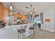 Modern kitchen with counter seating, stainless steel appliances, and tile backsplash at 7325 S Trask St, Tampa, FL 33616