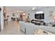 Open floor plan with living and dining areas featuring tile flooring and abundant natural light at 7325 S Trask St, Tampa, FL 33616