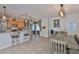 Open living space with kitchen, dining area, and a door to the backyard at 7325 S Trask St, Tampa, FL 33616