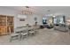 Open-concept area showcasing dining and living spaces with tile floors and neutral decor at 7325 S Trask St, Tampa, FL 33616
