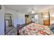 Bright and spacious main bedroom features a walk-in closet, wood floors, en suite bathroom, and large mirror at 7325 S Trask St, Tampa, FL 33616