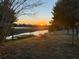 Enjoy the sunset over the water from this home's backyard view at 7820 Pineapple Ln, Port Richey, FL 34668