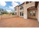 Charming front entrance with brick paving leading to double doors and arched features at 9707 Cabernet Ave, Seffner, FL 33584