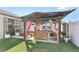 Inviting backyard space with a covered patio and outdoor kitchen, great for gatherings and relaxation at 13218 Satin Lily Dr, Riverview, FL 33579