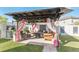Beautiful backyard with a large covered patio and outdoor kitchen perfect for entertaining at 13218 Satin Lily Dr, Riverview, FL 33579