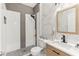 Stylish bathroom with a sleek step-in shower, modern fixtures, and a decorative accent for a contemporary appeal at 13218 Satin Lily Dr, Riverview, FL 33579
