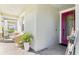 Welcoming front porch area featuring cozy seating and vibrant decorative accents at 13218 Satin Lily Dr, Riverview, FL 33579