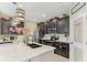 Well-equipped kitchen showcases a center island, pendant lights, sleek appliances, and pantry access at 13218 Satin Lily Dr, Riverview, FL 33579