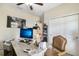 Bright home office featuring a work space and sliding door closet at 13218 Satin Lily Dr, Riverview, FL 33579