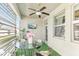 Inviting outdoor patio has dining area and wall-mounted TV with privacy screen at 13218 Satin Lily Dr, Riverview, FL 33579