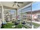 Inviting outdoor patio has dining area and hanging chair with privacy screen at 13218 Satin Lily Dr, Riverview, FL 33579