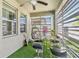 Inviting outdoor patio has dining area and hanging chair with privacy screen at 13218 Satin Lily Dr, Riverview, FL 33579