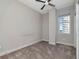 Light-filled bedroom with a ceiling fan, window, and neutral colored carpet at 1120 E Kennedy Blvd # 1523, Tampa, FL 33602
