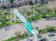 Aerial view of a pedestrian bridge with a street, trees, and cars below at 1120 E Kennedy Blvd # 1523, Tampa, FL 33602