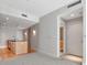Spacious living room with an open kitchen, hardwood floors, and a hallway entrance at 1120 E Kennedy Blvd # 1523, Tampa, FL 33602