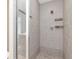 Walk-in shower with neutral tiling, and built in storage shelves at 1120 E Kennedy Blvd # 1523, Tampa, FL 33602