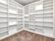 Large walk-in closet with extensive built-in shelving for storage at 1120 E Kennedy Blvd # 1523, Tampa, FL 33602