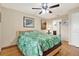 Comfortable bedroom with a ceiling fan, a window, and bamboo floors at 11901 4Th N St # 6303, St Petersburg, FL 33716