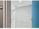 Bright entryway featuring neutral walls, tiled floor, and a pop of color from the blue door at 1208 E Kennedy Blvd # 1115, Tampa, FL 33602