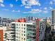 Exterior view of the condo's multiple stories with downtown views from the multiple balconies at 1208 E Kennedy Blvd # 1115, Tampa, FL 33602