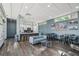 Well-equipped community kitchen with stainless steel appliances, countertop seating, and a cozy lounge area at 1208 E Kennedy Blvd # 1115, Tampa, FL 33602