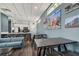 Well-equipped community kitchen with stainless steel appliances, countertop seating, and a cozy lounge area at 1208 E Kennedy Blvd # 1115, Tampa, FL 33602