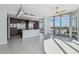 Modern living space with stainless steel appliances, sleek cabinets and large windows offering city views at 1208 E Kennedy Blvd # 1115, Tampa, FL 33602