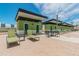 Spacious roof deck with lounge chairs and modern cabana buildings, perfect for relaxing or entertaining at 1208 E Kennedy Blvd # 1115, Tampa, FL 33602