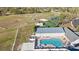 Aerial photo highlighting community amenities, including a pool, baseball field, and tennis courts at 12112 Feldwood Creek Ln, Riverview, FL 33579