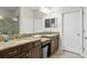 Spacious bathroom features double sinks with granite countertops and ample storage space at 12326 Terracina Chase Ct, Tampa, FL 33625