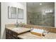 Elegant bathroom with granite countertops, dual sinks, and a spacious shower, offering a spa-like experience at 12326 Terracina Chase Ct, Tampa, FL 33625