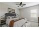 Stylishly decorated bedroom with neutral walls and flooring, complemented by contemporary furniture at 12326 Terracina Chase Ct, Tampa, FL 33625