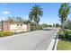 Welcome to Terracina Townhomes; entrance sign amid lush greenery and clear blue sky at 12326 Terracina Chase Ct, Tampa, FL 33625