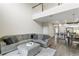 Open-concept living space showcases high ceilings, blending living, dining, and kitchen areas, enhancing spaciousness at 12326 Terracina Chase Ct, Tampa, FL 33625
