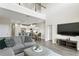 Spacious open-plan living area features a modern kitchen and comfortable seating arrangement, perfect for gatherings at 12326 Terracina Chase Ct, Tampa, FL 33625