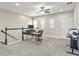 An open loft area provides versatile space, brightened by natural light from multiple windows and complemented by a ceiling fan at 12326 Terracina Chase Ct, Tampa, FL 33625