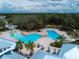 Aerial view of a community pool with waterslide and seating at 13106 Zolo Springs Cir, Riverview, FL 33579