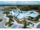 Aerial view of the fitness center, pool and surrounding landscape at 13106 Zolo Springs Cir, Riverview, FL 33579