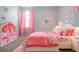 Bright bedroom featuring unique décor, a large bed, and plenty of natural light at 13106 Zolo Springs Cir, Riverview, FL 33579