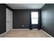 Bedroom featuring neutral decor, carpet, and a bright window for natural light at 13106 Zolo Springs Cir, Riverview, FL 33579