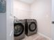 Laundry room featuring modern washer and dryer units, and a convenient layout at 13106 Zolo Springs Cir, Riverview, FL 33579