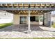 Outdoor patio featuring stone flooring, covered ceiling, and backyard views at 13106 Zolo Springs Cir, Riverview, FL 33579