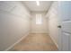 Walk-in closet with metal shelving for organized storage and a small window for natural light at 13106 Zolo Springs Cir, Riverview, FL 33579