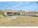 Spacious backyard featuring a screened porch, a shed, and a well-maintained lawn at 13216 Parkhurst Ct, Riverview, FL 33569