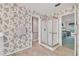 Bathroom with glass shower and views into the primary bedroom at 13216 Parkhurst Ct, Riverview, FL 33569
