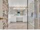 Ensuite bathroom featuring a glass enclosed shower, and floral wallpaper at 13216 Parkhurst Ct, Riverview, FL 33569