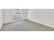 Vacant bedroom with beige carpet flooring and a window to provide light at 13216 Parkhurst Ct, Riverview, FL 33569
