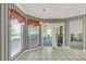The eat-in area has lots of light and leads to a screened patio at 13216 Parkhurst Ct, Riverview, FL 33569